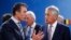 NATO Secretary-General Anders Fogh Rasmussen (left) talks to U.S. Defense Secretary Chuck Hagel during a NATO-Georgia defense ministers' meeting in Brussels in 2013.
