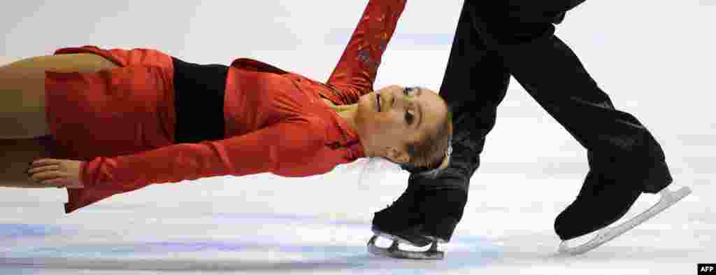 Ukrainian pair Julia Lavrentieva and Yuri Rudyk perform in Zagreb, Croatia, during the pairs free skating on day two of the ISU European Figure Skating Championships. (AFP/Attila Kisbenedek)