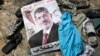 A poster of deposed Egyptian President Muhammad Morsi that reads "No to the coup" lies amid the debris of a protest camp in Cairo.