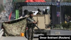 An Afghan National Army (ANA) soldier stands guard at a checkpoint in Kabul on September 10.