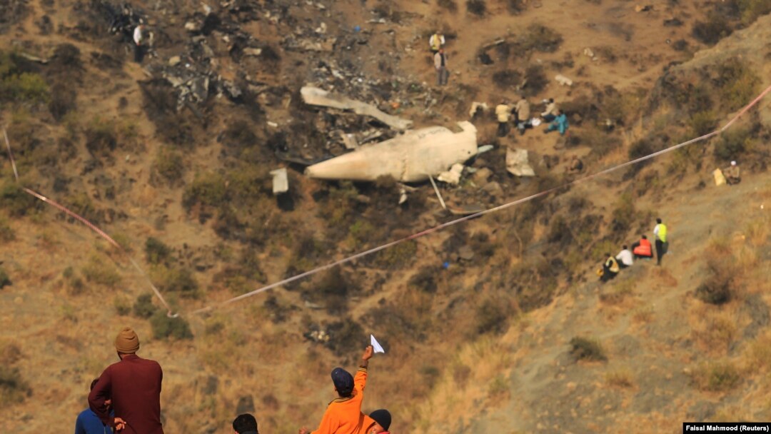 A view of the site of a December 7 plane crash in the village of Saddha Batolni near Abbotabad.
