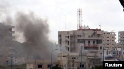 Syria -- Smoke rises after explosions hit the Syrian city of Tartus, May 23, 2016