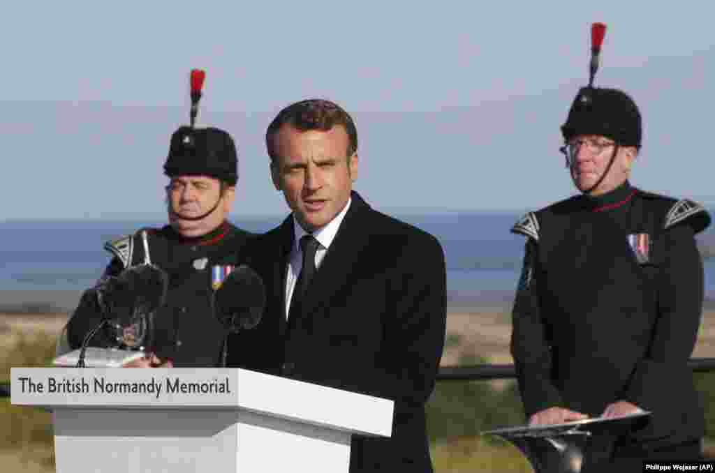 FRANCE -- French President Emmanuel Macron delivers a speech during a Franco-British ceremony to mark the 75th anniversary of D-Day landings and laying the first stone of a British memorial at Ver-Sur-Mer, Normandy, June 6, 2019. Macron thanked the veterans and "all those who were killed so that France could become free again." The event will be followed a few hours later by a ceremony attended by Macron and Trump to pay tribute to fallen U.S. soldiers at the Normandy American Cemetery.
