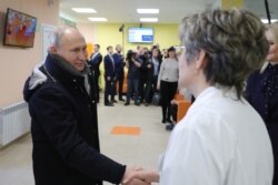 Putin visits a local children's clinic in the town of Usman in the Lipetsk region on January 22.