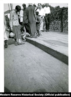 This photo taken by Whiting Williams in August 1933 appeared in an article he wrote for a British magazine a year later but had been largely forgotten until now. It was originally published with the caption "Factory women passing a tiny victim of famine: a dead child lying on a pavement in Kharkov." (Whiting Williams Photographs/Western Reserve Historical Society)