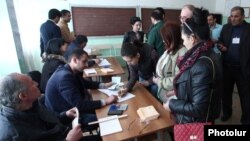 Armenia - Voters prepare to cast ballots at a polling station in Hrazdan, 17Apr2016.