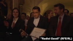 Jamshed Yorov holds the award after the ceremony in Prague on March 5.