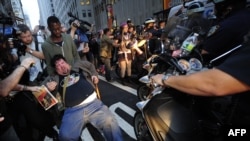 Occupy Wall Street protesters march on Broadway in October. According to at least one Iranian cleric, their movement is a sign of the impending return of a Shi'ite messiah, the Hidden Imam.