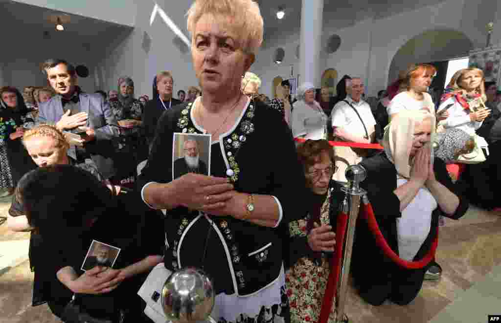 Believers in Kyiv attend a funeral ceremony for Lubomyr Husar, the ex-head of the Ukrainian Greek Catholic Church, who died late last month. (AFP/Sergei Supinsky)