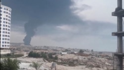 A plume of smoke rises on July 30 after reported strikes on Iran's Qeshm Island the previous night. 