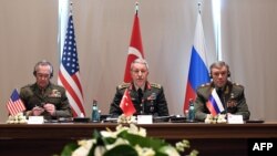 Turkey's Chief of Staff General Hulusi Akar (center) meets with U.S. Chairman of the Joint Chiefs of Staff Joseph Dunford (left) and Russian Armed Forces Chief of Staff Valery Gerasimov in Antalya on March 7. 