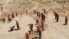 FILE: Laborers work on trenches on a hill to help improve the capital Kabul's water supply, amid the coronavirus disease (COVID-19) outbreak in June.