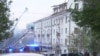 Firefighters work at the site of a drone strike in Dnipro.