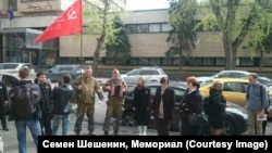 Russian nationalists are pictured after their attack against attendees of a ceremony for high school history students. The protesters reportedly yelled that the competition's participants were "whores, not students."