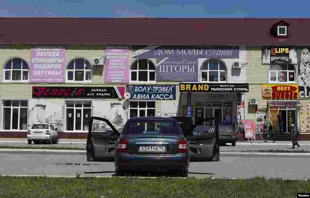 Advertising covers a market in central Grozny.