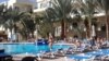 EGYPT -- Tourists enjoy their time off at the pool of a hotel in Red Sea resort of Hurghada, January 9 2016. 