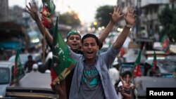 Supporters of Imran Khan's Justice Movement rally on the last day of campaigning in Karachi on May 9.