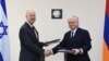 Armenia - Armenian Foreign Minister Edward Nalbandian (R) and Israel's Minister of Regional Cooperation Tzachi Hanegbi sign bilateral agreements after talks in Yerevan, 25Jul2017.