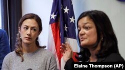 American-Iranian Negah Hekmati, left, looks on as Rep. Pramila Jayapal, D-Wash., addresses a news conference about Hekmati's ordeal during an hours-long delay returning to the U.S. from Cana. Seattle. January 6, 2020