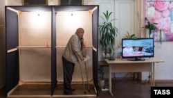 A man votes at a polling station in Sukhumi during a referendum on a snap presidential election in Abkhazia on July 10.
