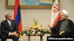 Iran - President Hassan Rohani (R) meets with his visiting Armenian counterpart Serzh Sarkisian in Tehran, 5Aug2013.