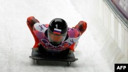 Russia's bobsledder Sergei Chudinov competes Sochi Winter Olympics, February 15, 2014