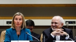 EU foreign policy chief Federica Mogherini (left) and Iranian Foreign Minister Mohammad Javad Zarif attend a ministerial meeting of the P5+1 countries and Iran held on the sidelines of the 73rd session of the UN General Assembly at the United Nati