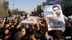 Mourners carry the coffin of nuclear scientist Mostafa Ahmadi-Roshan, during his funeral in Tehran on January 13. 