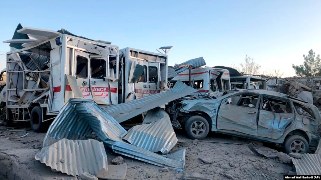 Damaged vehicles are seen at the site of a car bombing in Qalat, capital of Zabul Province, on September 19.