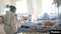 Armenia -- A healthcare worker clad in protective gear looks after COVID-19 patients at the Surb Grigor Lusavorich Medical Center, Yerevan, June 5, 2020.