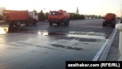 Trucks deployed in the eastern city of Turkmenabat disinfect the streets. 