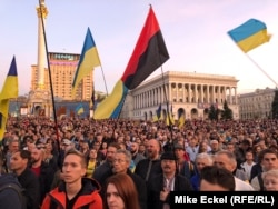 Tens of thousands crowd into Kyiv's Independence Square on March 14 to mark Defenders Day.