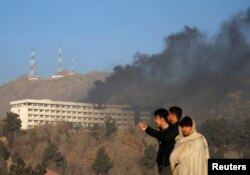 Smoke rises from the Intercontinental Hotel on January 21 hours after the attack had ended.