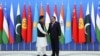 Tajik President Emomali Rahmon (right) shakes hands with Pakistani Prime Minister Imran Khan during the Shanghai Cooperation Organization (SCO) summit in Dushanbe on September 17.