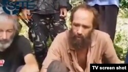 Kanađanin Robert Hol i Norvežanin Kjartan Sekingstad na snimku Abu Sayafa