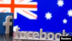 Logo e Facebook-ut dhe flamuri australian në prapavijë. 