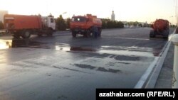 Trucks deployed in the eastern city of Turkmenabat disinfect the streets. 