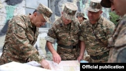 Armenia - Defense Minister Seyran Ohanian (L) visits an Armenian army post on the border with Azerbaijan, 9Aug2013.