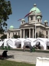 White tents in front of Serbian Parliament