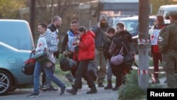 Evacuees from the Azovstal steel plant arrive at a temporary accommodation center in Ukraine's Donetsk region on May 6.