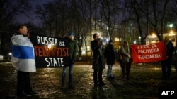 Protesters gather on February 16 in front of the Russian Embassy in Stockholm after the news that the Kremlin's most prominent critic, Alekesei Navalny, had died in an Arctic prison.