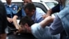 Armenia - Hayk Kyureghian is overpowered by police officers after firing gunshots outside a court in Yerevan, 12Jun2014.