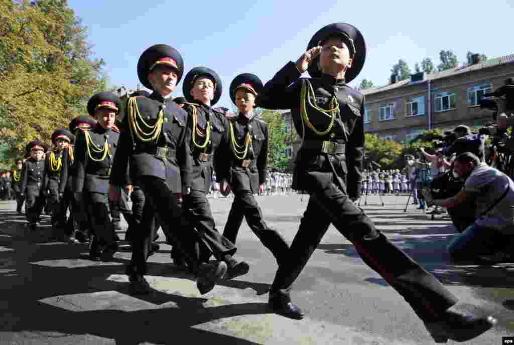 Young Ukrainian cadets march in a schoolyard during ceremonies marking the first day of school in Kyiv on September 1. (epa/Tatyana Zenkovich)