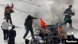 Protesters burned a Chinese flag during demonstrations in the Tibetan capital, Lhasa, in March 2008.