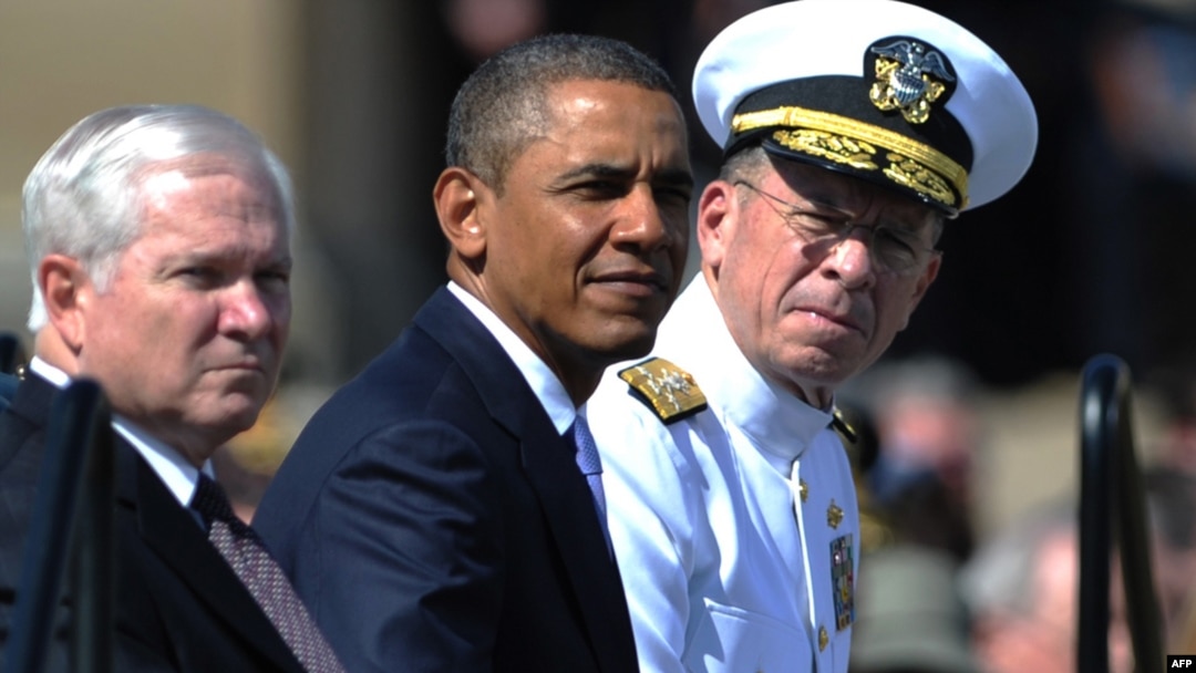 U.S. President Barack Obama (center) was flanked at a tribute in June by outgoing Defense Secretary Robert Gates (left) and Admiral Mike Mullen, both of whom concluded the repeal wouldn't harm the military.