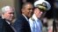 U.S. President Barack Obama (center) was flanked at a tribute in June by outgoing Defense Secretary Robert Gates (left) and Admiral Mike Mullen, both of whom concluded the repeal wouldn't harm the military.