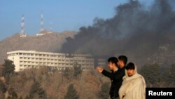 Smoke rises from the Intercontinental Hotel on January 21 hours after the attack had ended,