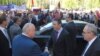 NATO Secretary General Anders Fogh Rasmussen (C) arrives at Yerevan State University as hundreds of students protest against the release of Azerbaijani officer Ramil Safarov from a Hungarian prison, 6Sept2012.