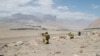 FILE: Border guards along Tajikistan's border with Afghanistan