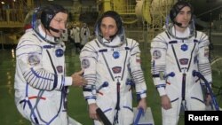 ISS crew members (left to right) U.S. astronaut Daniel Burbank and Russian cosmonauts Anton Shkaplerov and Anatoly Ivanishin train at the Baikonur cosmodrome in November.